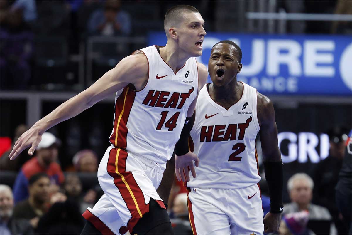 Miami Heat guard Tyler Herro (14) celebrates with guard Terry Rozier (2) in the second half against the Detroit Pistons at Little Caesars Arena.