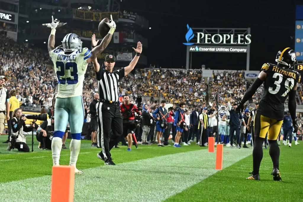 Oct 6, 2024; Pittsburgh, Pennsylvania, USA; Dallas Cowboys running back Rico Dowdle (23) celebrates a touchdown pass from quarterback Dak Prescott against the Pittsburgh Steelers during the fourth quarter at Acrisure Stadium. Mandatory Credit: Barry Reeger-Imagn Images